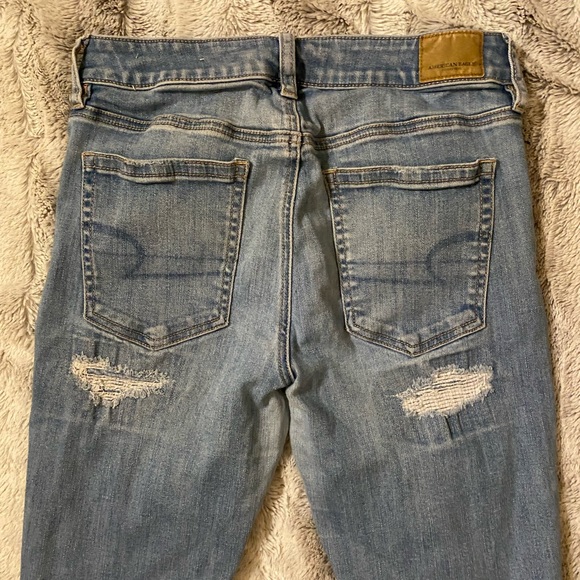 American Eagle | High Rise Super Stretch Skinny Distressed Light Blue Jeans - Picture 5 of 7
